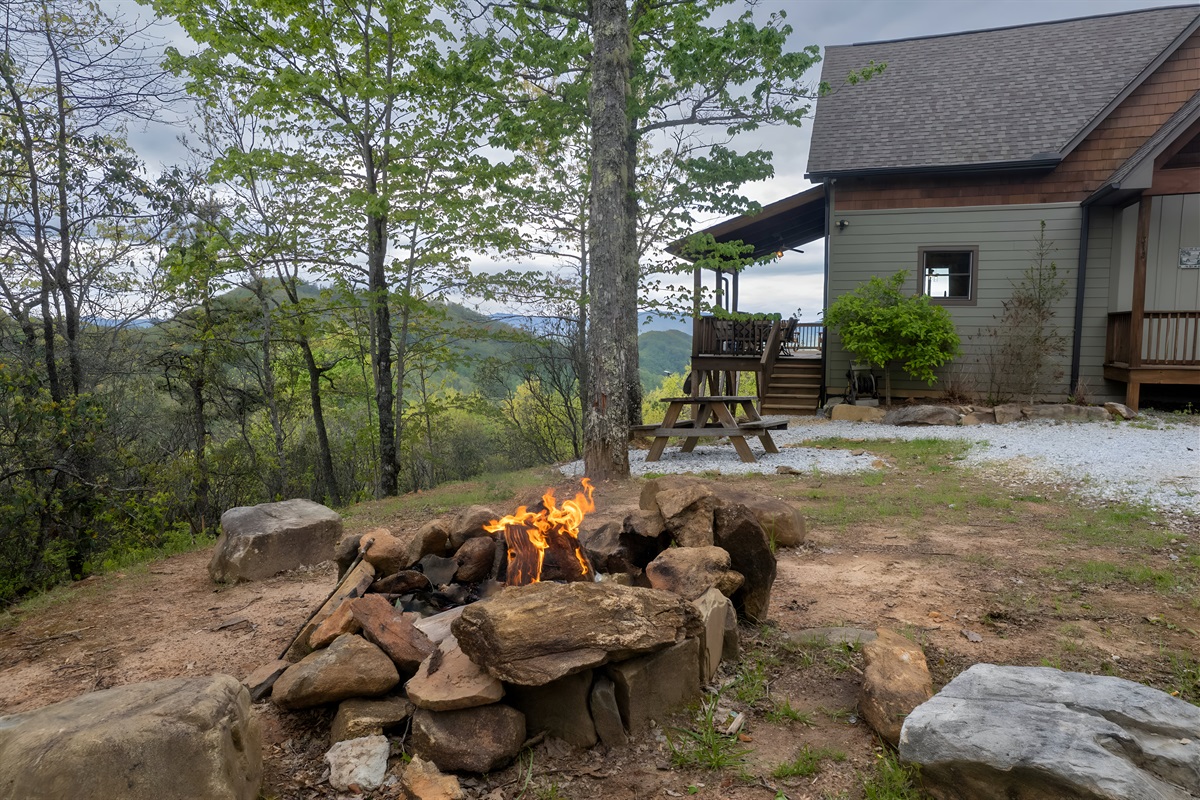 Stay warm outside with a crackling fire pit in the front of the house.