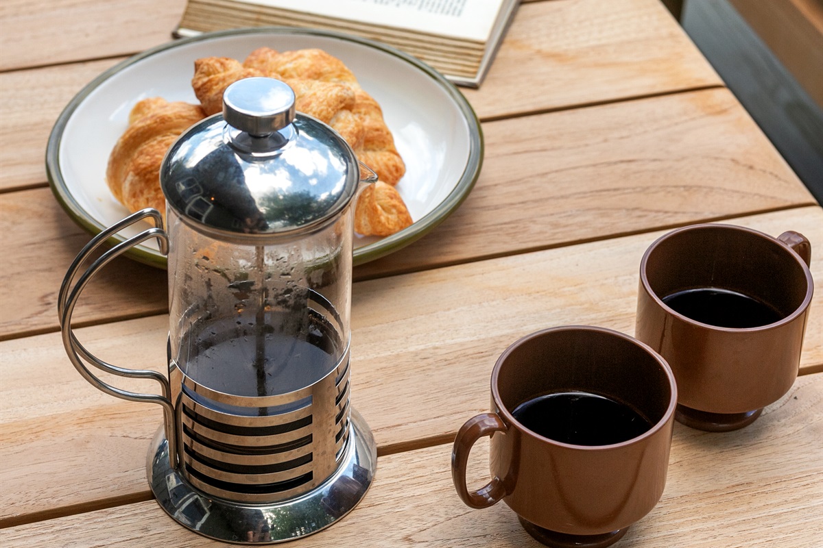 Start your day by enjoying a leisurely breakfast with a warm cup of coffee, taking in the peaceful surroundings.