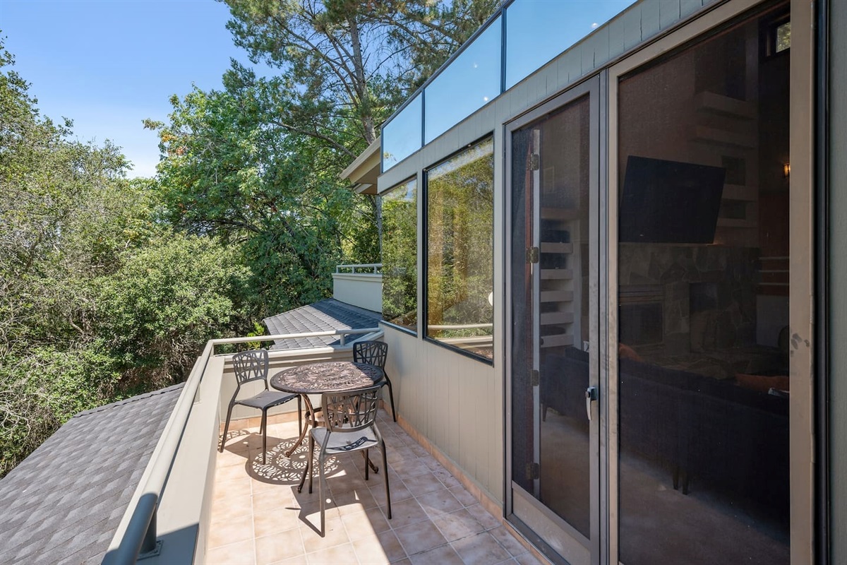 There are two balconies on the upper level overlooking the pool and the view of Santa Rosa beyond. This balcony is located just off of the great room (living room, kitchen, and dining area).