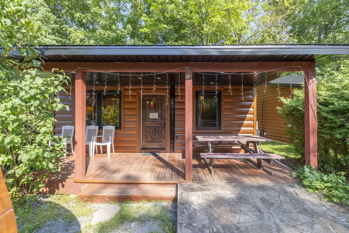 Cottage #5 exterior with covered porch and private outdoor area