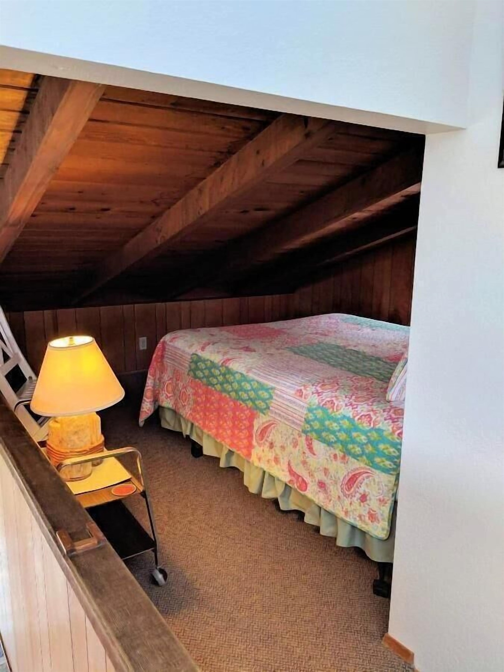 queen bed in open loft