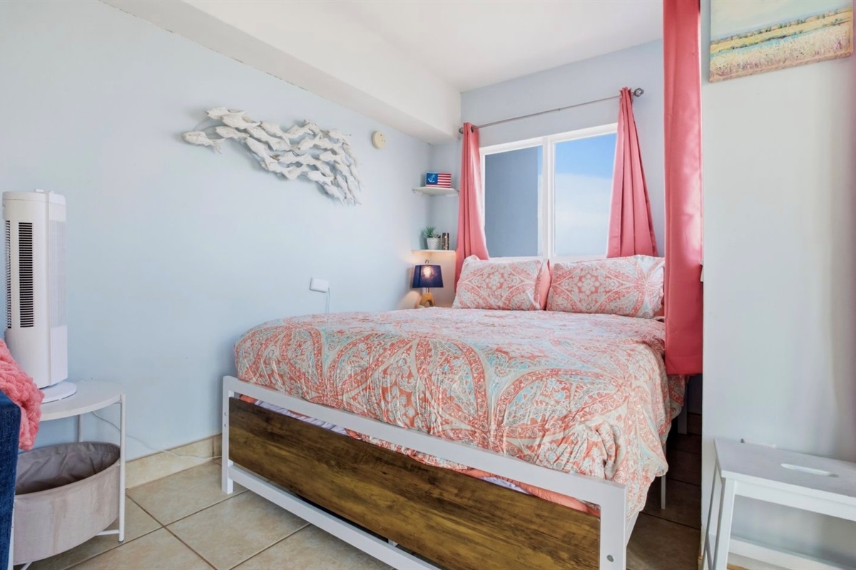 Rest easy in a cozy queen bed styled for comfort, calm, and romance. Soft bedding, peaceful coastal colors, and oceanfront window views create the perfect place to wake up slowly, sip coffee, and start the day with the sunrise. ⭐