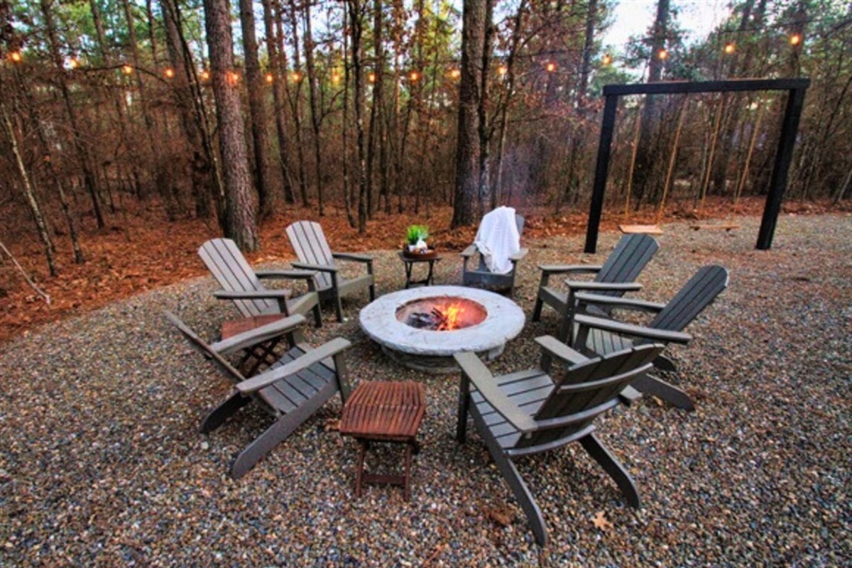Gather around the fire pit for cozy evenings under the stars, complete with Adirondack chairs for relaxing and roasting s’mores.