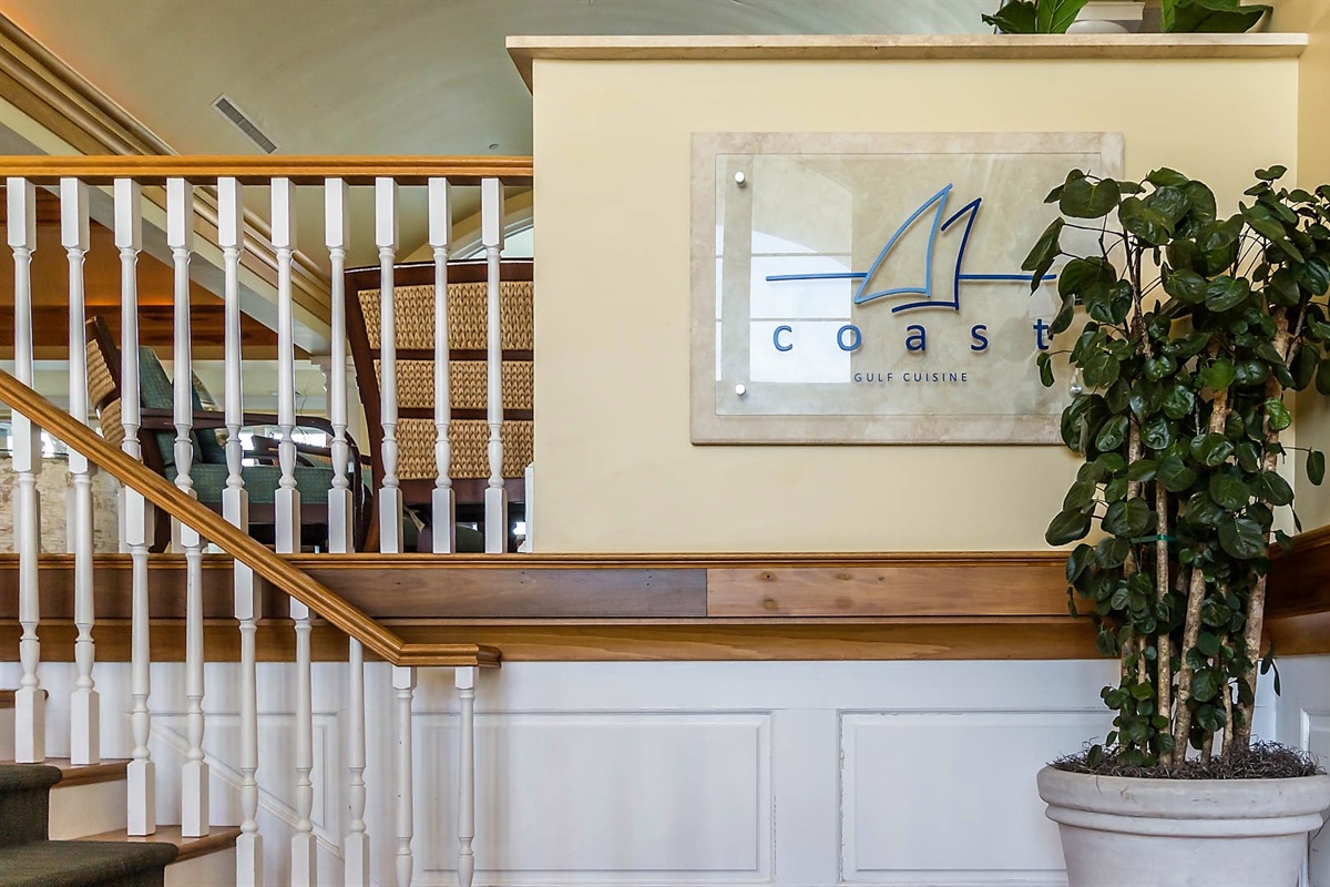 Experience the warm, inviting atmosphere at The Coast Restaurant. Our thoughtfully designed space, featuring rich wood accents and ambient lighting, provides the perfect setting for an unforgettable dining experience