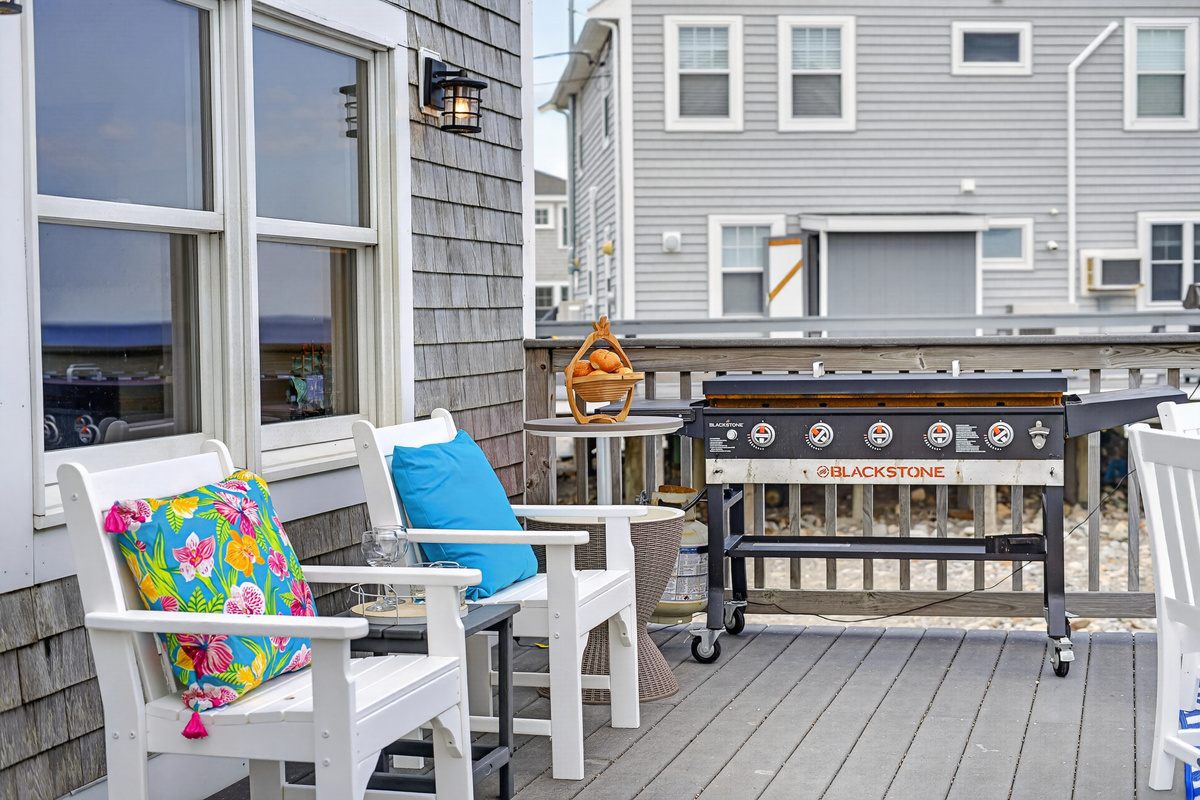 Enjoy an elevated grilling experience on our coastal deck, complete with comfortable seating and thoughtful touches.