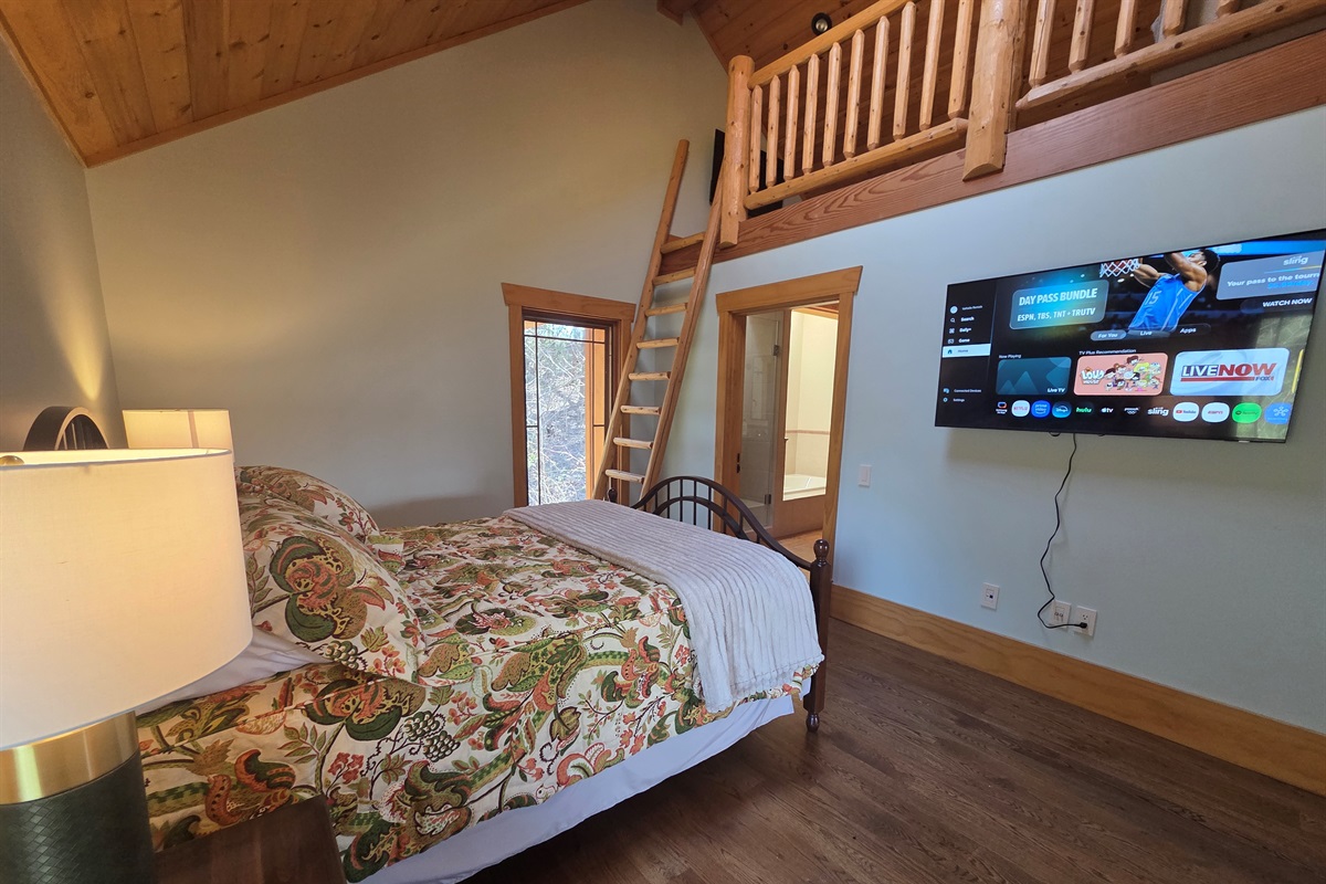 Carriage apartment bedroom with a queen bed