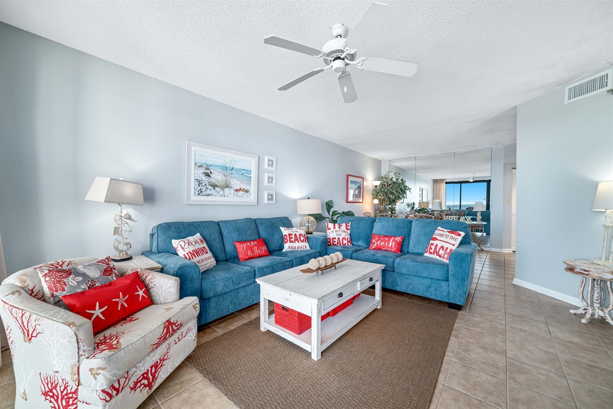 A light-filled living space with captivating views. This inviting room offers a perfect blend of comfort and style, creating a welcoming atmosphere for all.