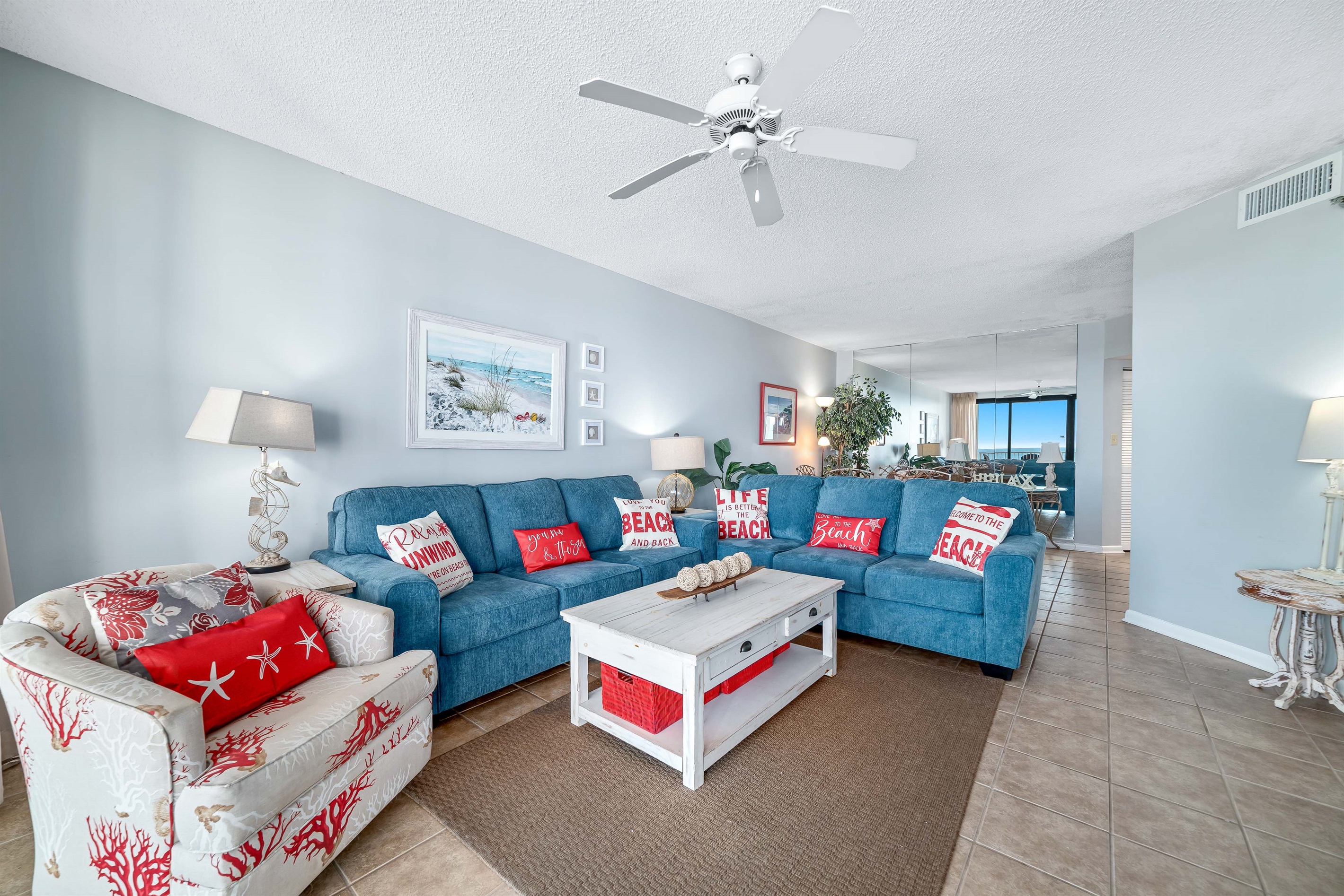 A light-filled living space with captivating views. This inviting room offers a perfect blend of comfort and style, creating a welcoming atmosphere for all.