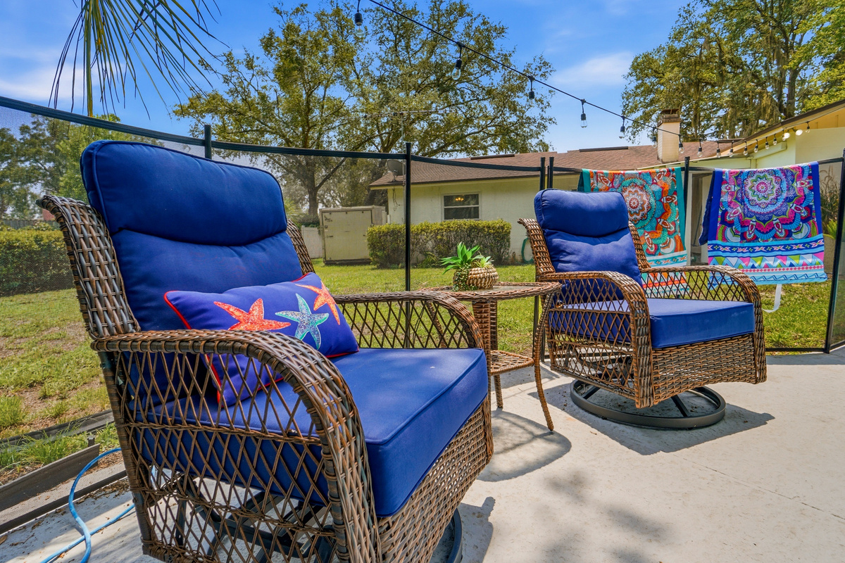 Comfortable poolside seating provides a sunny place to relax between swims.