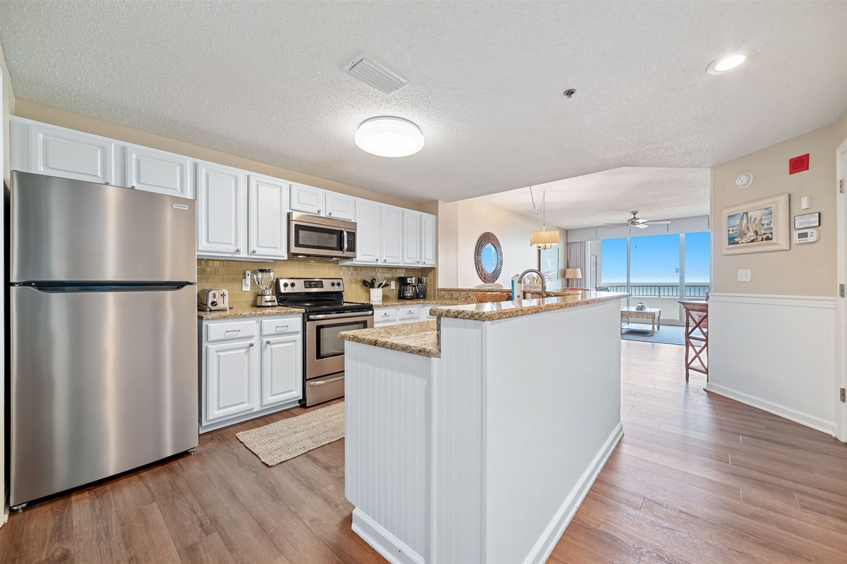 A well-equipped kitchen featuring modern appliances and stylish finishes, perfect for culinary enthusiasts.