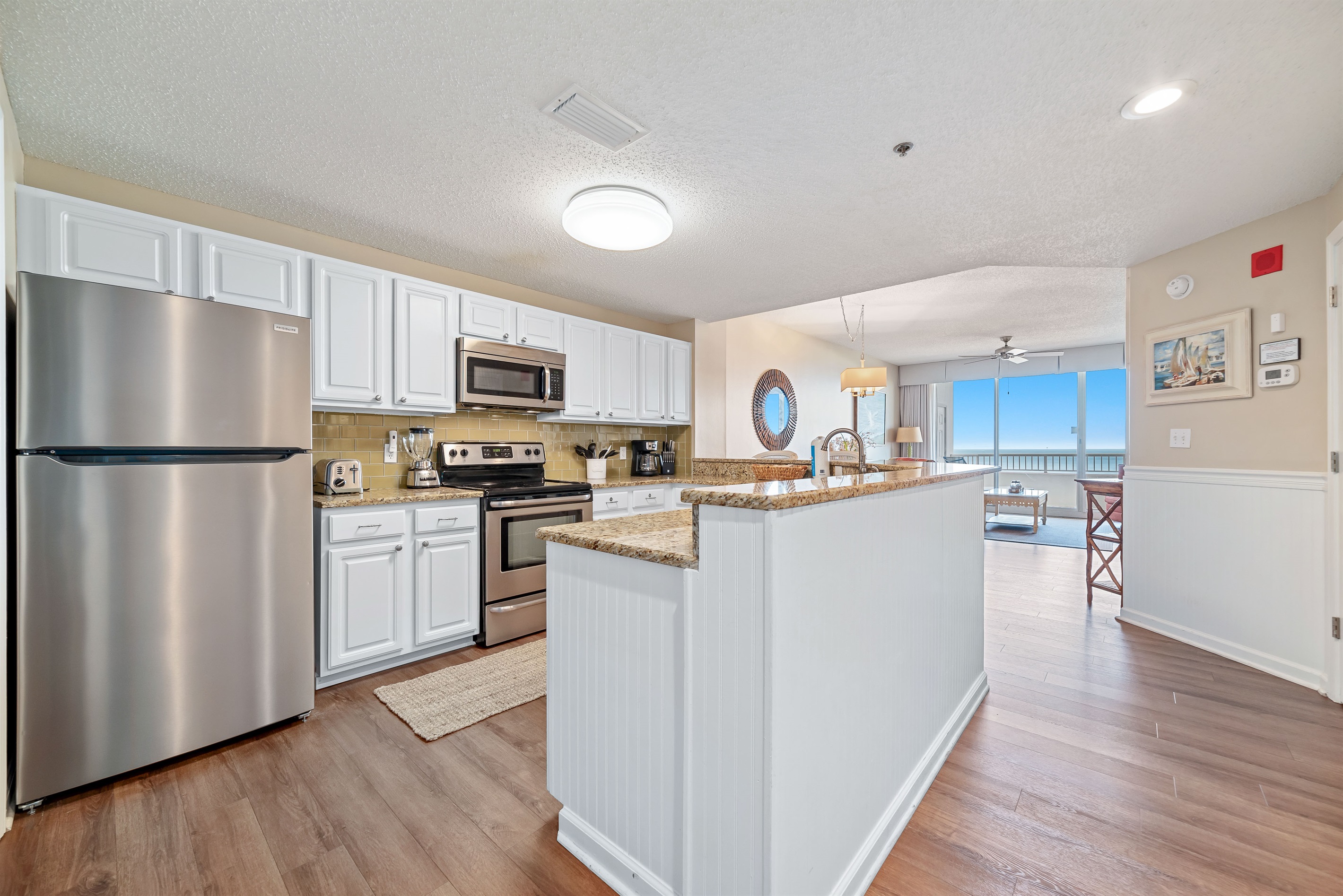 A well-equipped kitchen featuring modern appliances and stylish finishes, perfect for culinary enthusiasts.