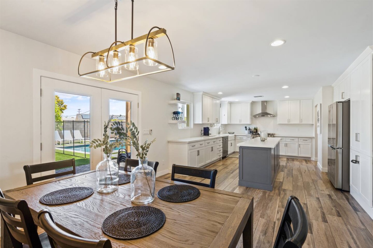 Dining space with seating for shared meals, patio doors nearby, and open flow from the kitchen.