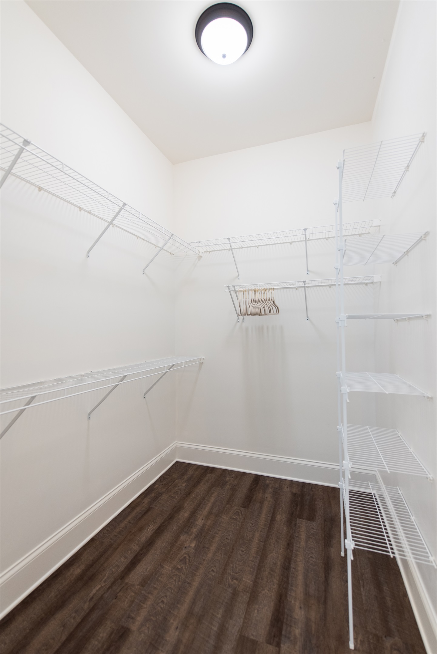 This walk-in closet is spacious, with plenty of room for all your clothes and accessories.