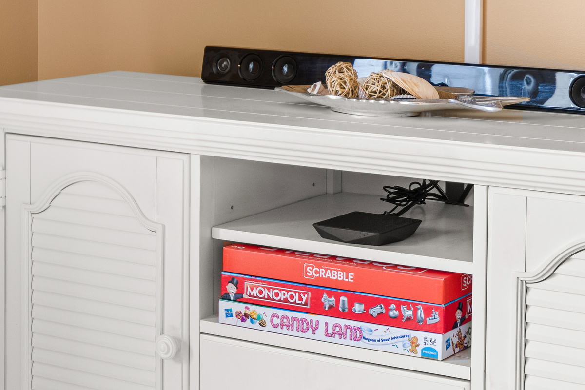 Lots of Board Games in the Media Cabinet