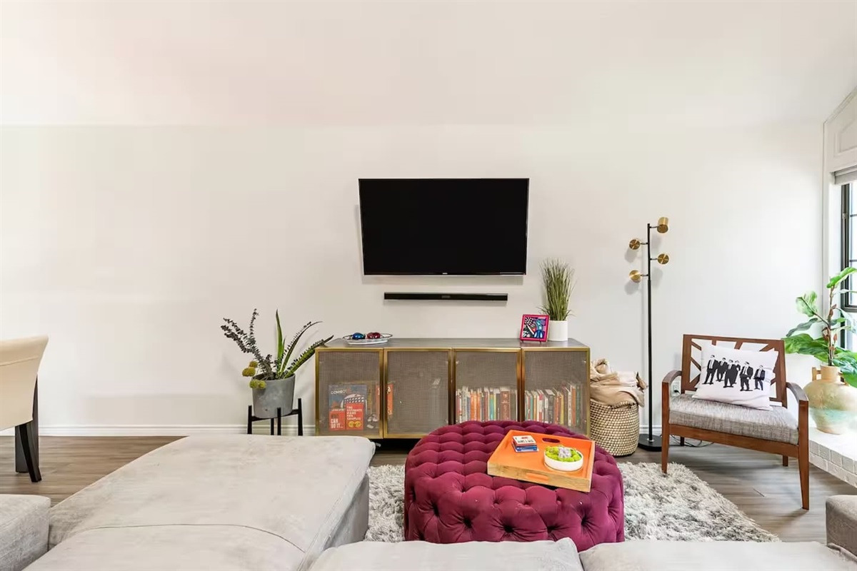 Living room with sectional sofa and pops of color.