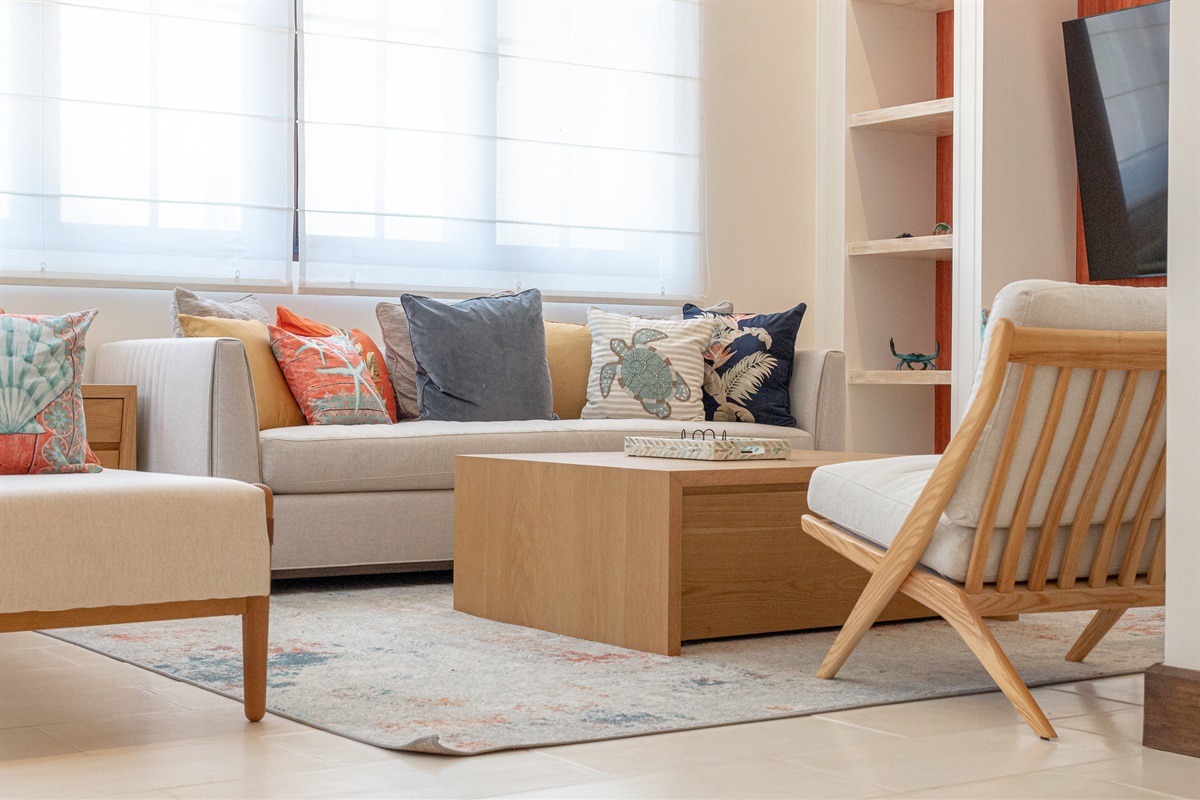Located in the right wing beside the kitchen, the large living room directly off the pool area is perfect for relaxing after a day at the beach.