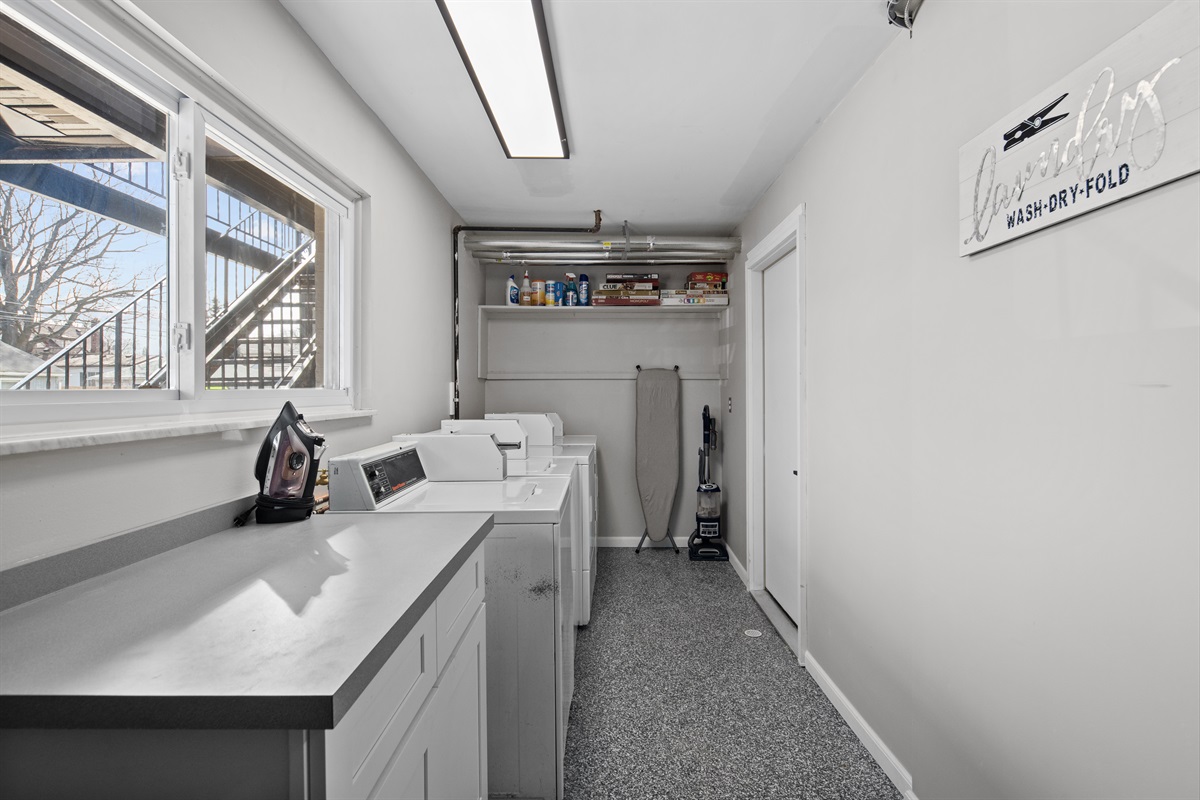 Enjoy the convenience of an on-site laundry room, fully equipped with washers, dryers, ironing essentials, and ample counter space for folding.