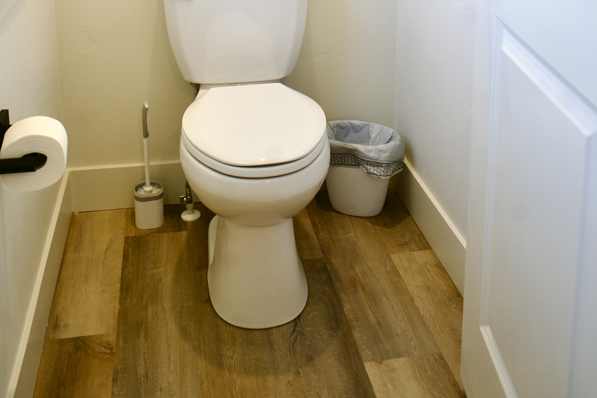 The master bathroom includes a private toilet area with a door for enhanced privacy.