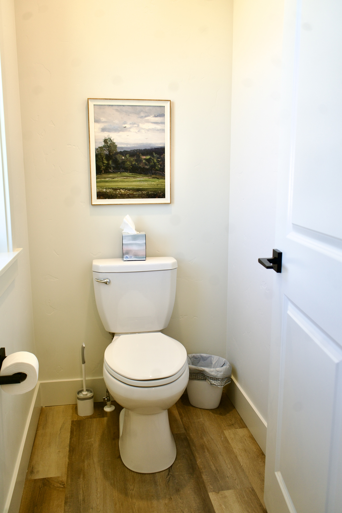 The master bathroom includes a private toilet area with a door for enhanced privacy.