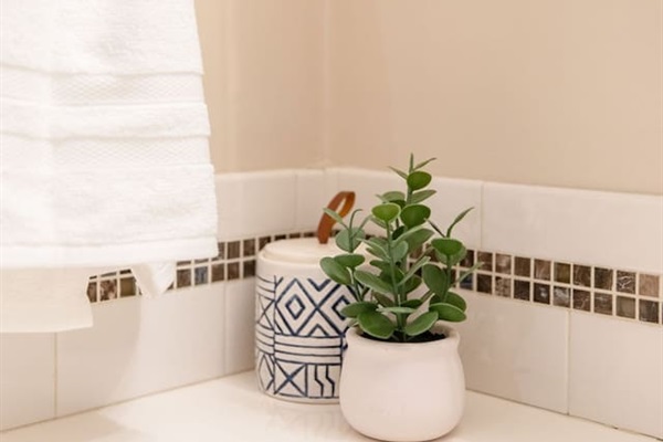 Fully equipped bathroom with a shower, sink, toilet, and all the essentials you need for a comfortable stay.