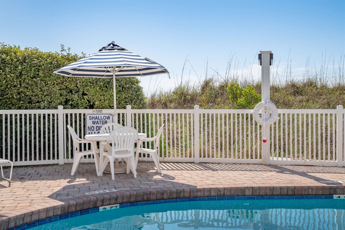 Enjoy the Portofino shared pool.  Ten houses share this beautiful pool located directly in front of Portofino 1424.  The pool deck boasts 4 tables with umbrellas and multiple lounge chairs.  Hi The pool is heated in April, May, September and October 