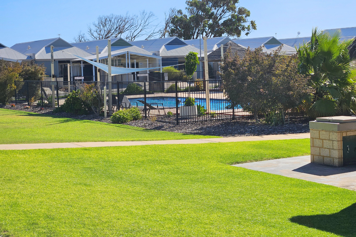 Lawna area with the complex but outside U45 with shared BBQ area
