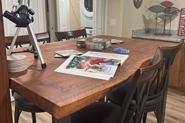 Lower level  live edge top / bar chairs