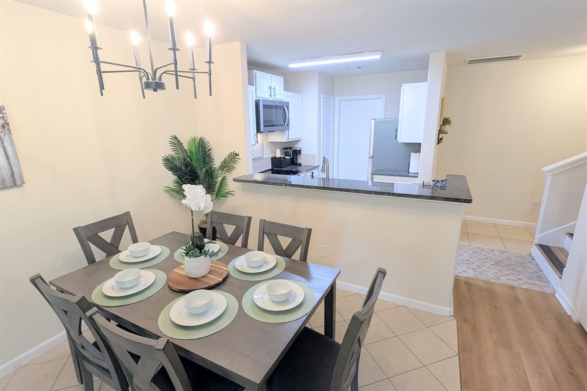 Dining room is located off the kitchen in this open concept living space. 