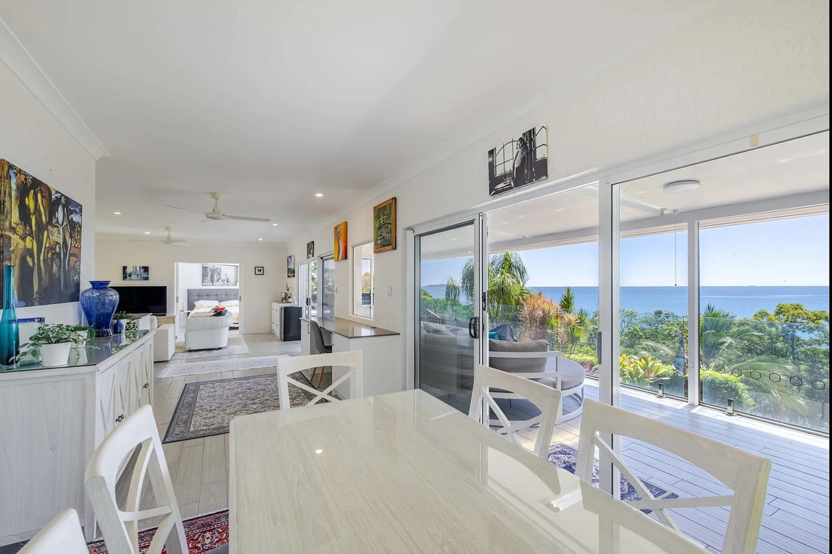 The dining area connects easily with the lounge and covered deck, giving the home a bright indoor-outdoor layout for relaxed stays.