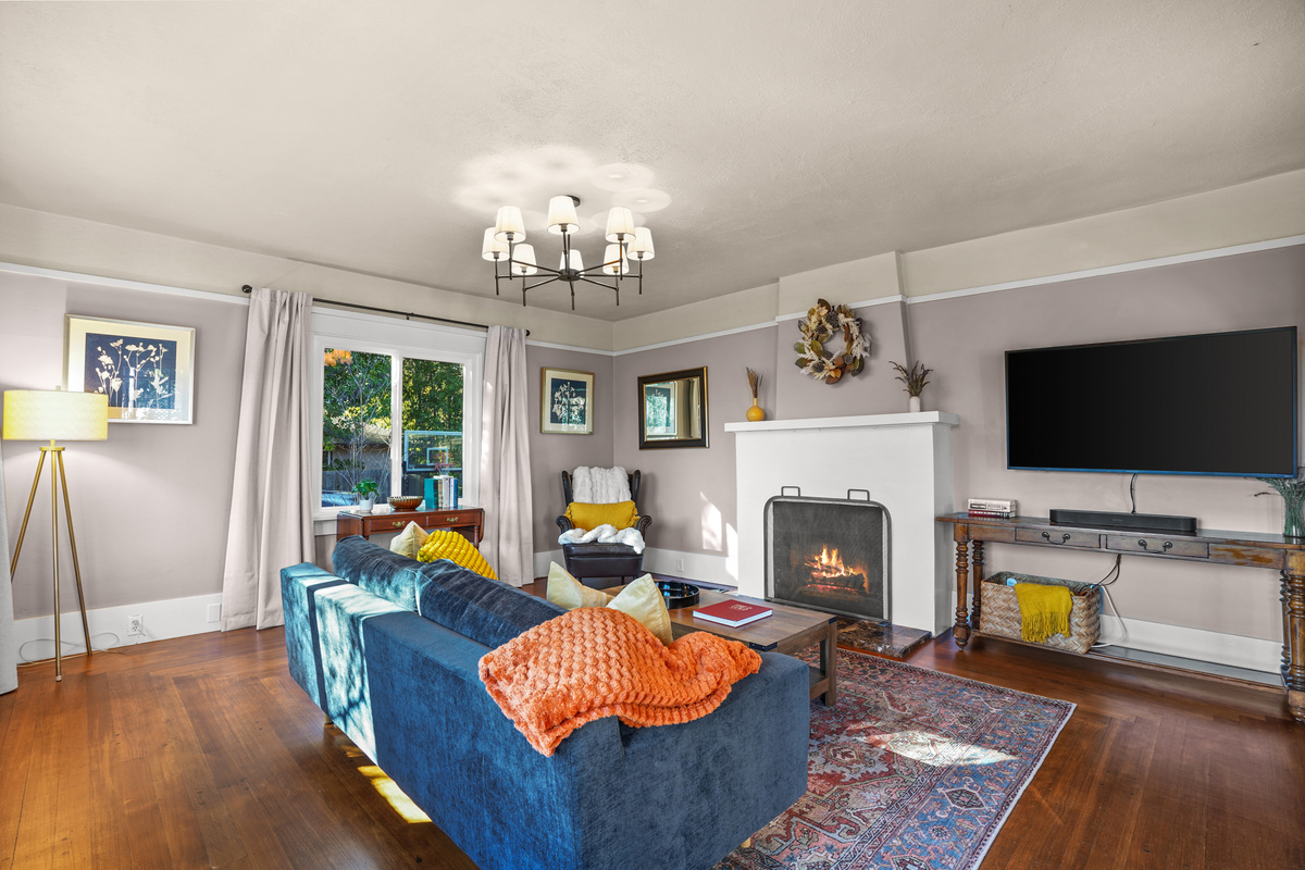 Relax in the inviting living room, complete with comfortable seating and a Smart TV for streaming your favorite movies and shows. It's the perfect place to unwind, gather with family and friends, or enjoy a cozy night in.