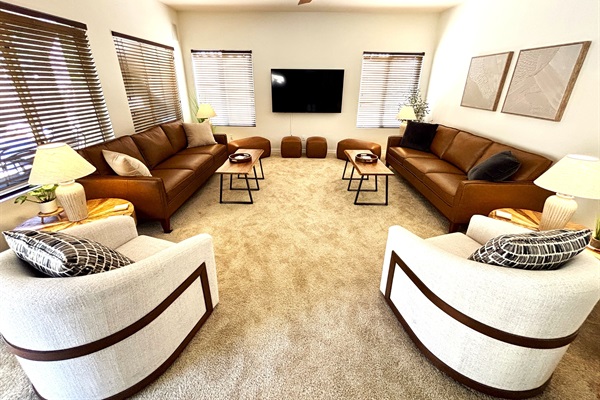 Open concept family room with 65" smart TV and plenty of seating