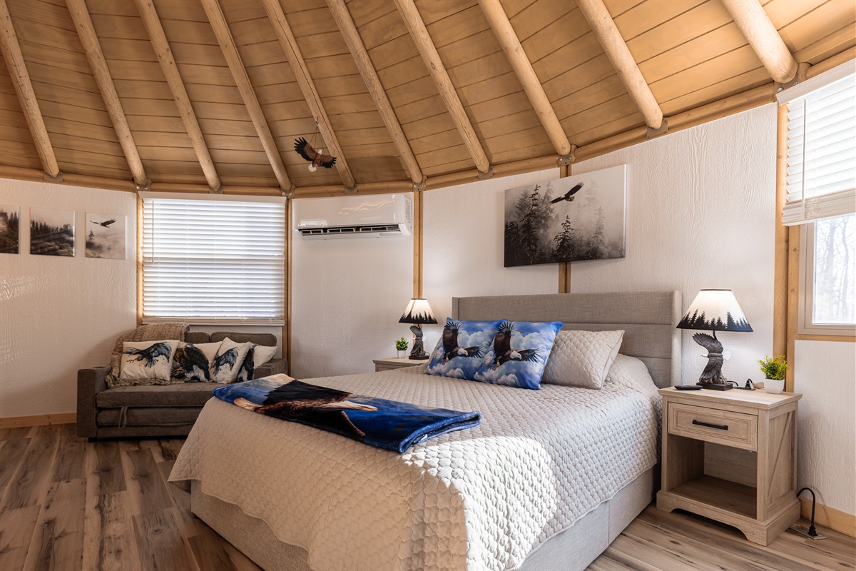 Sleep beneath the dome in a plush king bed, with a cozy loveseat for relaxing and reading.