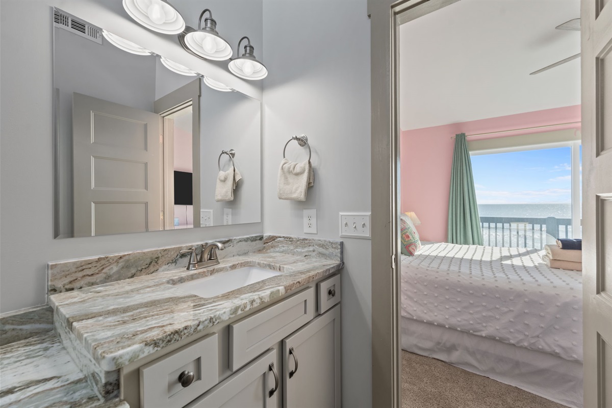 Master bathroom with a stone vanity, generous counter space, and direct access to the bedroom&mdash;comfortable and practical for daily routines