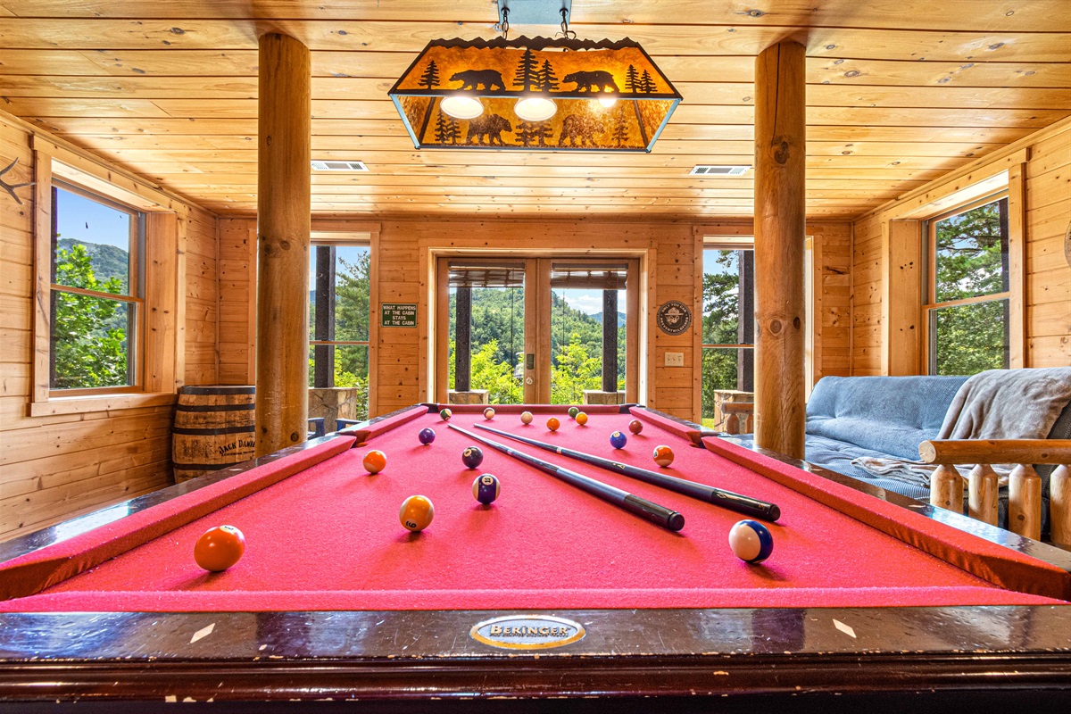 Downstairs Game Room: Challenge friends to a game while soaking in stunning mountain views!