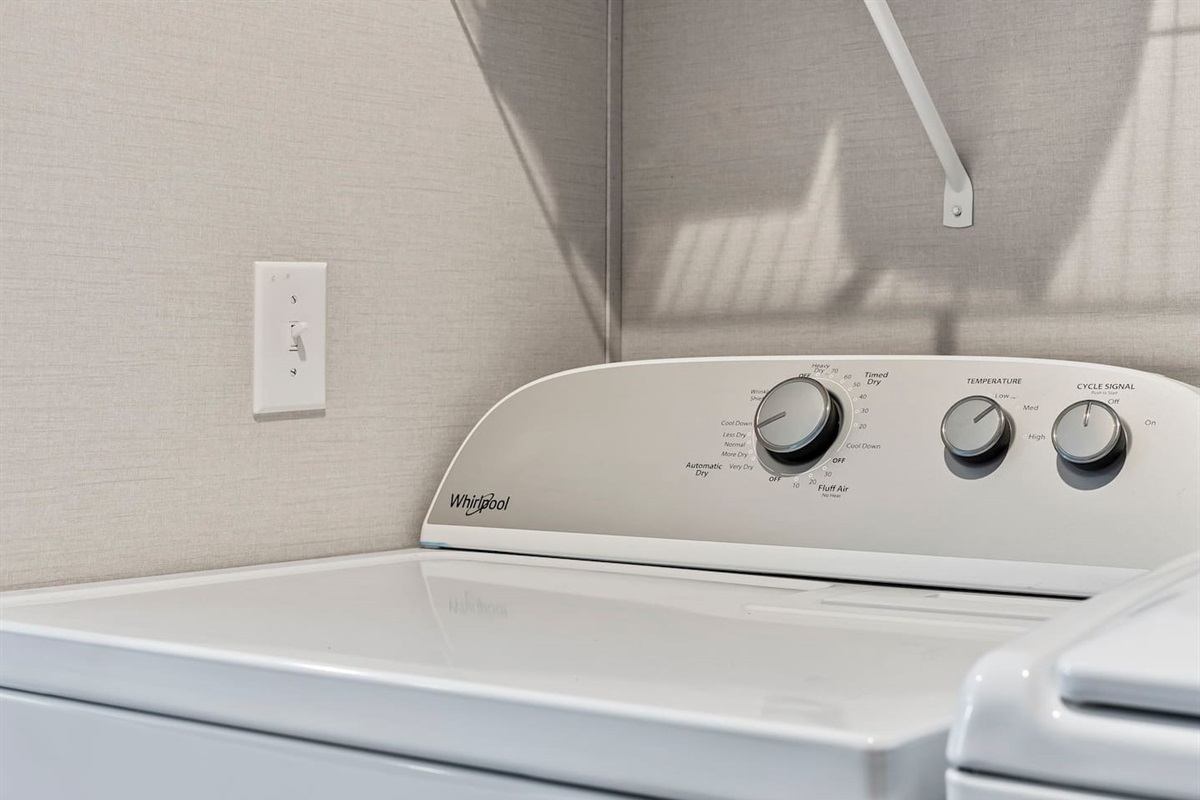 Spacious dryer and laundry space with everything you need to keep clothes fresh during your stay.
