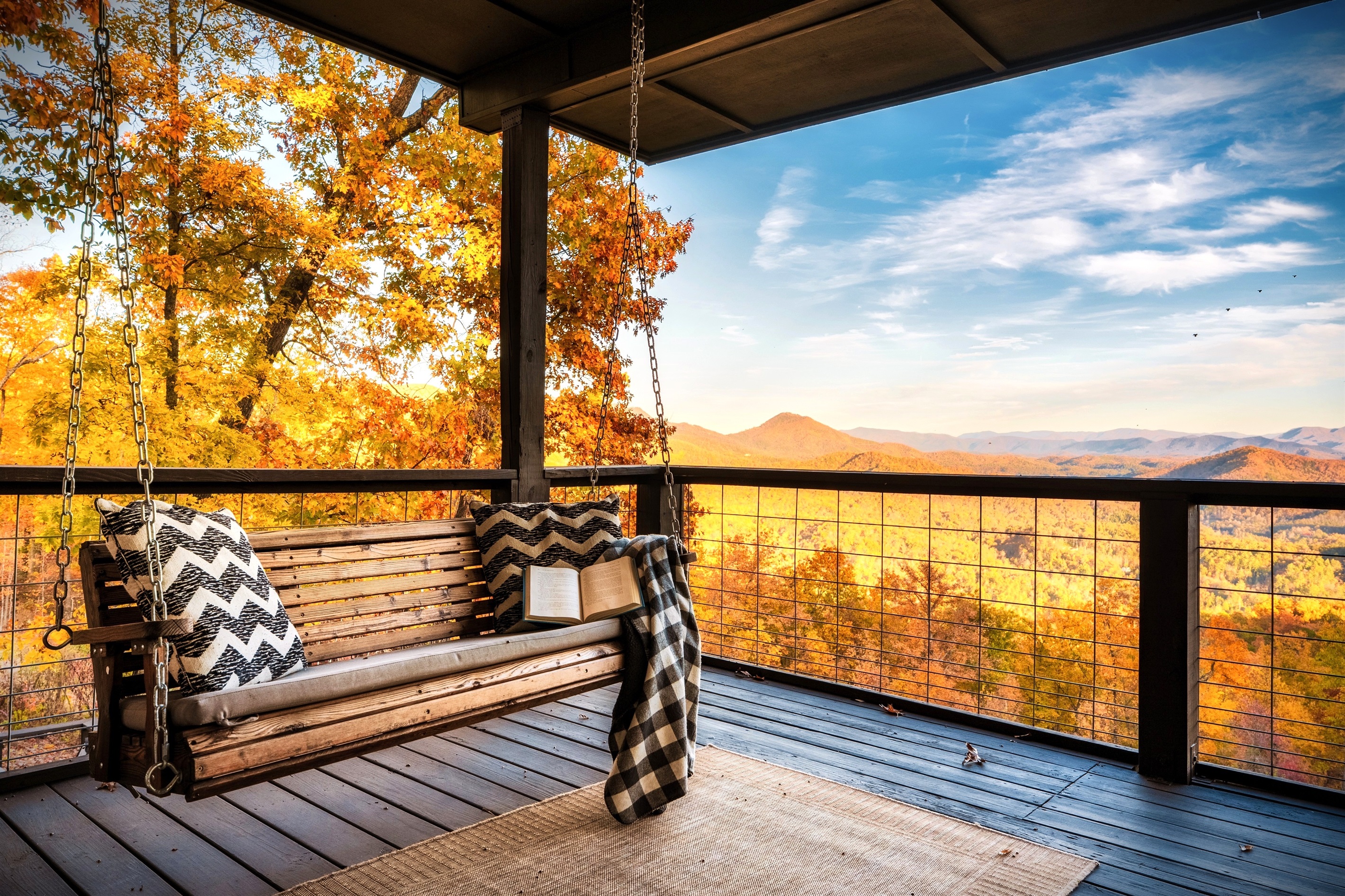 Wake up to a warm majestic sunrise while swinging your brand new day. Mountain air. Coffee in hand. Laughter with friends and family. Life is perfect.