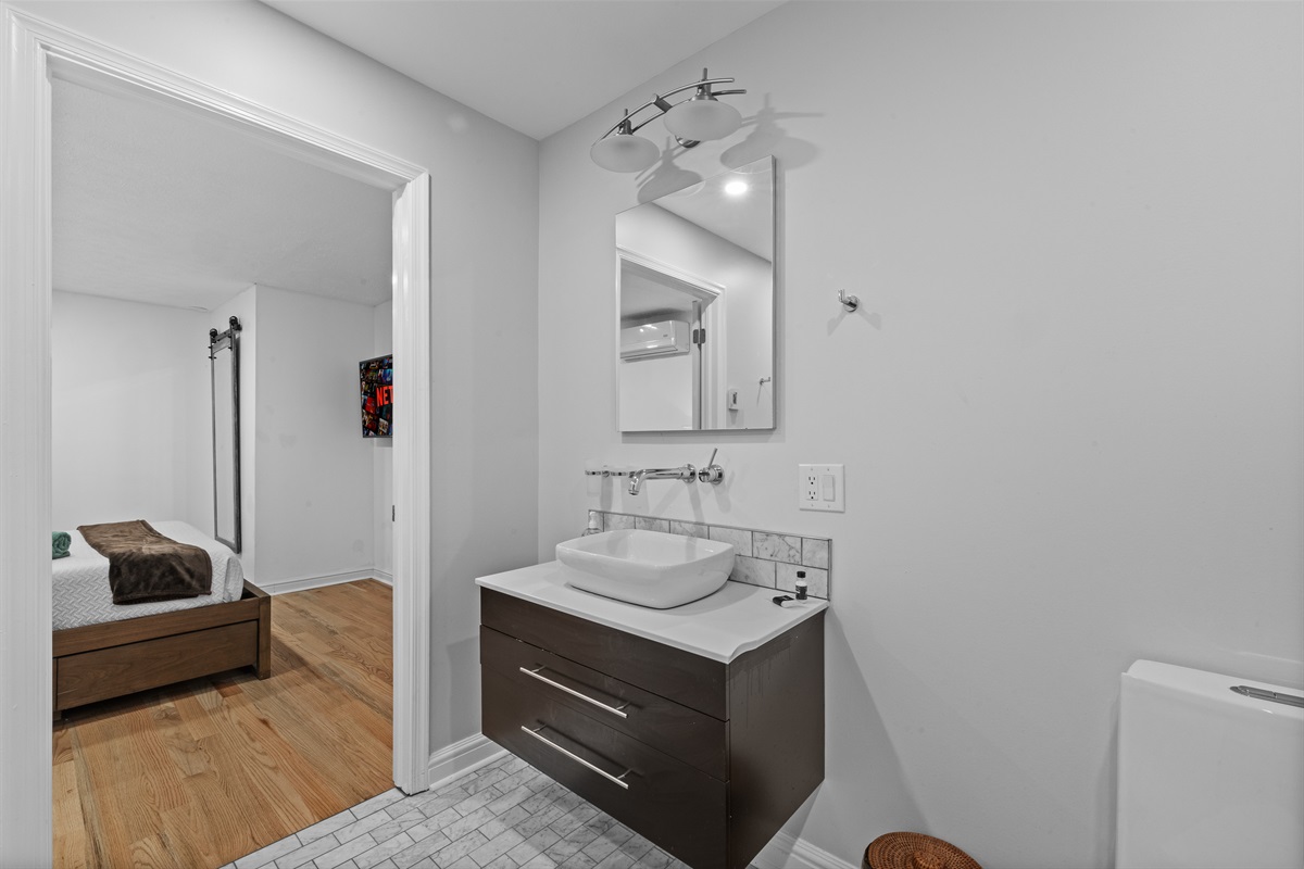Spacious full bathroom featuring both a walk-in shower and soaking tub