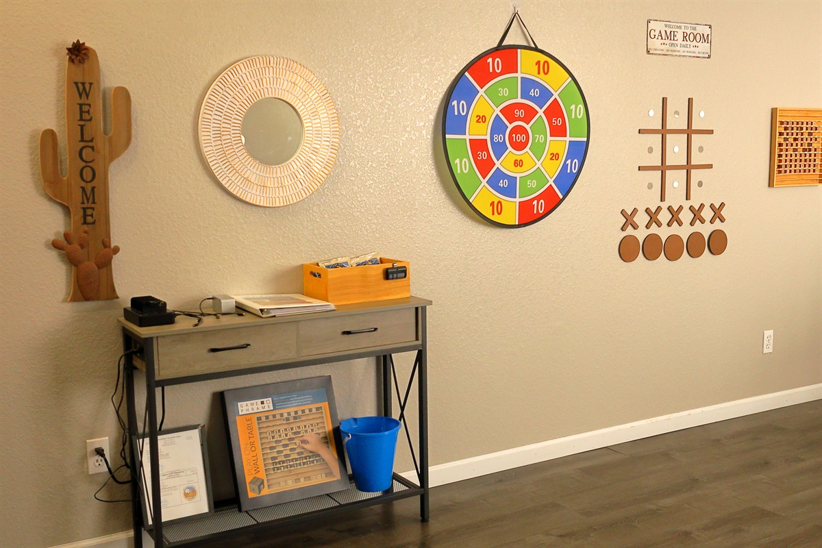 The living room has a custom game wall where your family can engage in some fun, friendly competition.