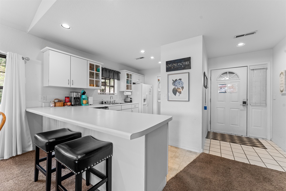 Breakfast bar seating and a fully equipped kitchen make quick breakfasts and easy takeout nights simple.