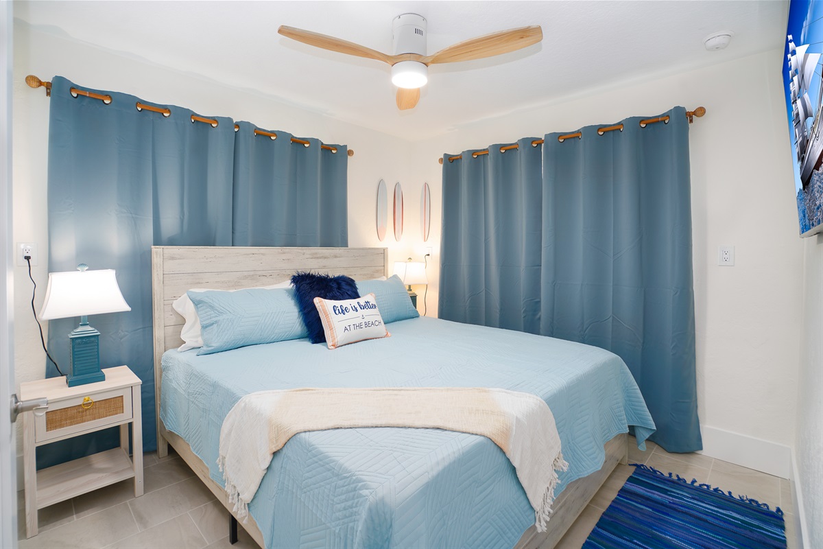 Bedroom 2 offers a king bed and smart TV.