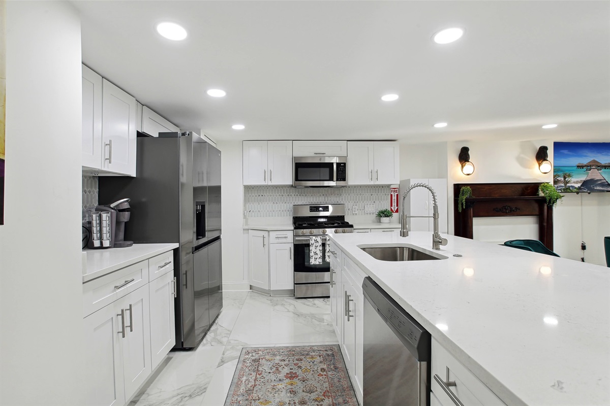 The lower level kitchen is fully equipped with new appliances and all the utensils, pots and pans needed to whip up a meal