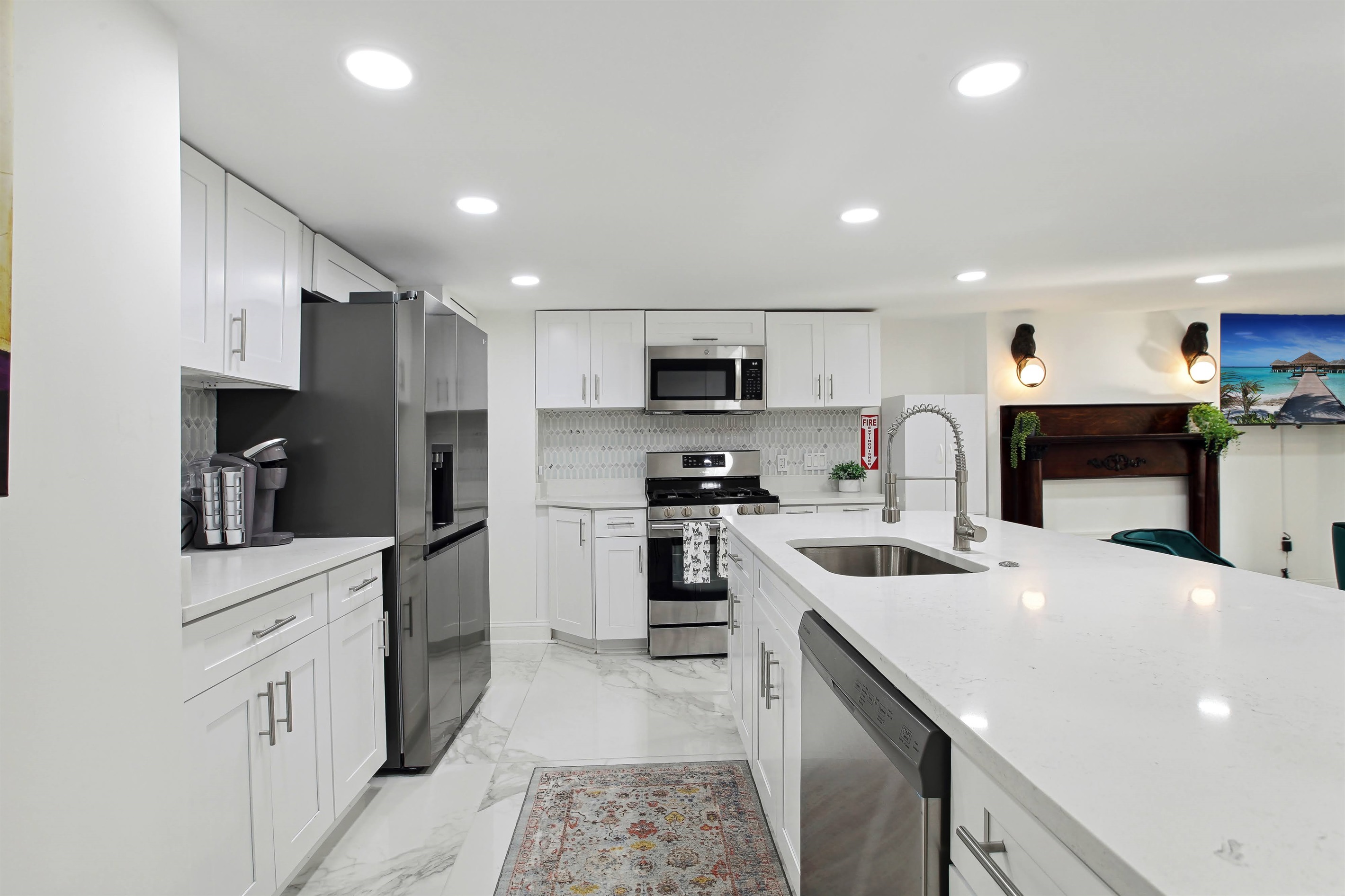 The lower level kitchen is fully equipped with new appliances and all the utensils, pots and pans needed to whip up a meal