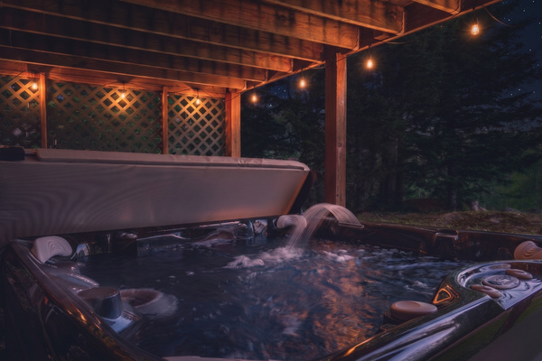 Soak away your stress in the private hot tub, available year-round for ultimate relaxation.