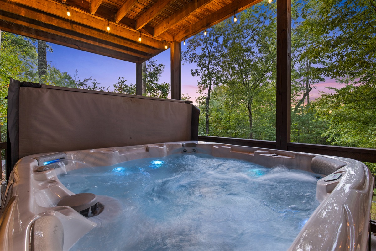 Sink into bubbling bliss... the hot tub, your perfect spot to unwind after a day of mountain adventures.