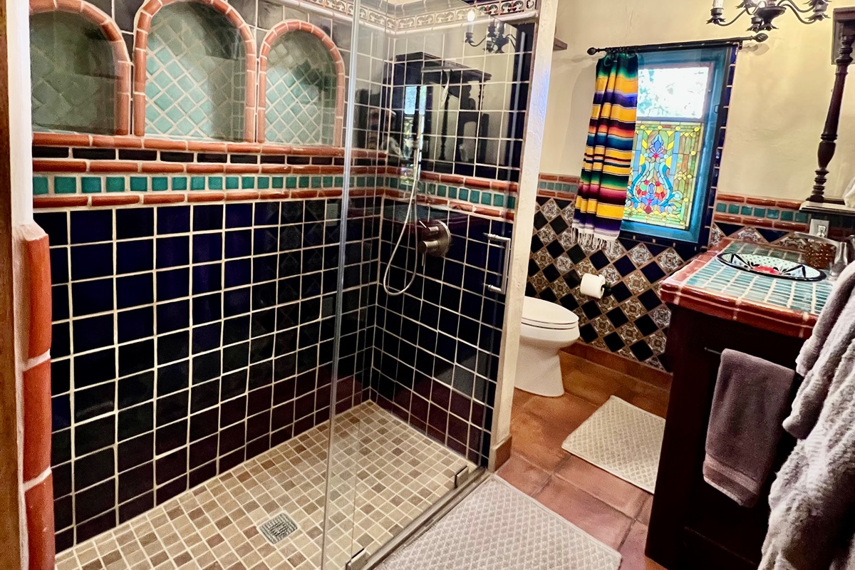 Immerse yourself in the vibrant colors and patterns of this Mexican-inspired bathroom.