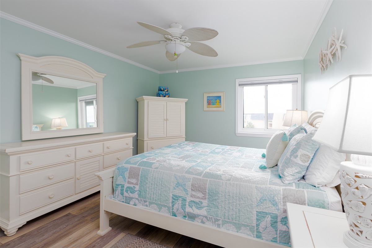 Master bedroom showcases a dresser with multiple drawers