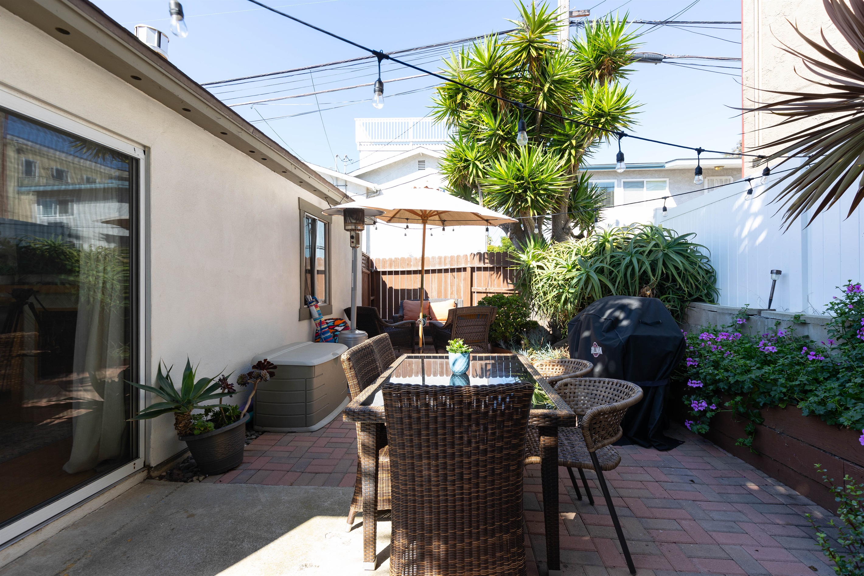 The Backyard Patio has string lighting and a propane heater to make outside nights more enjoyable. 