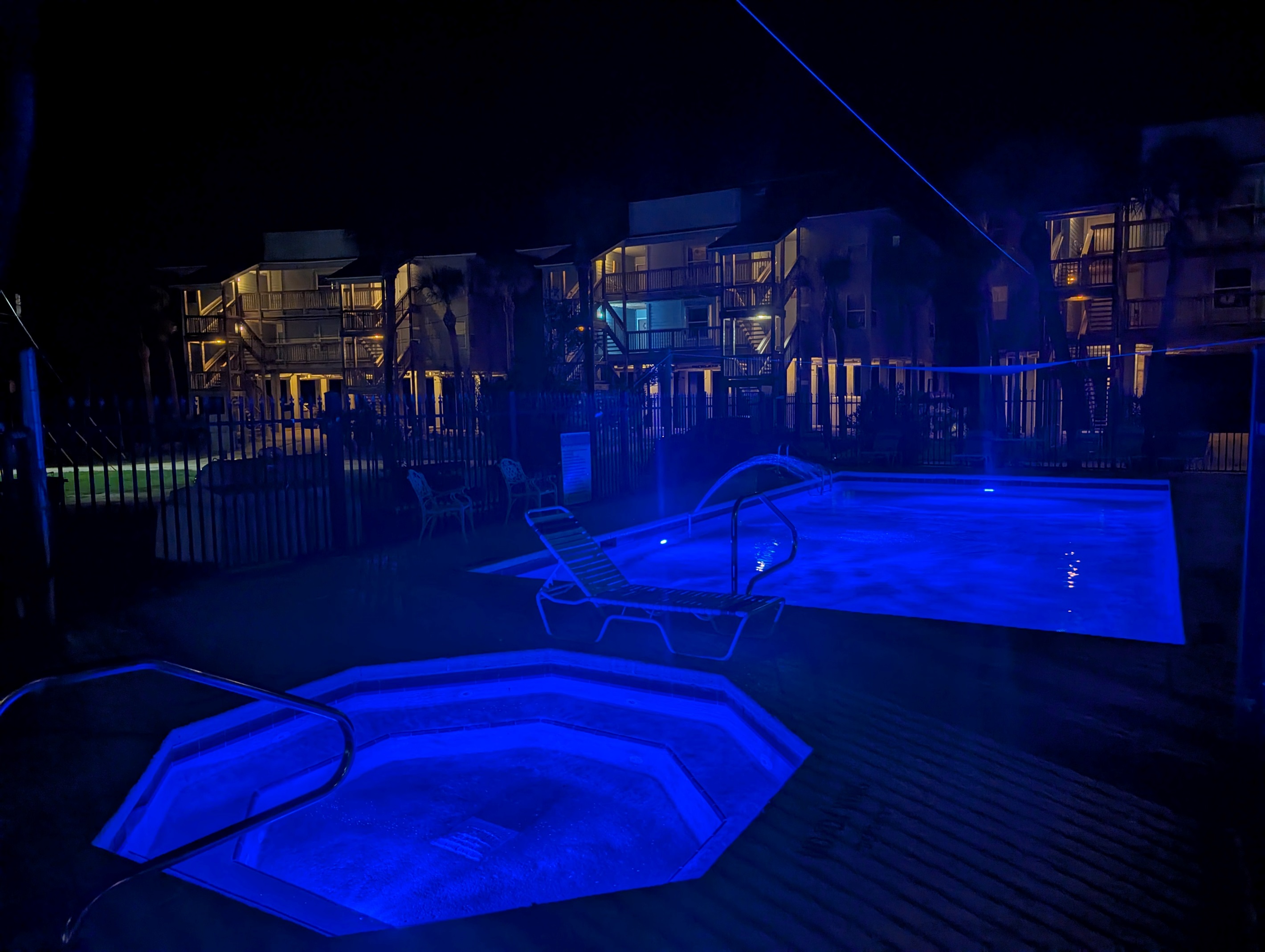 Night-time View of Pool and Hot Tub