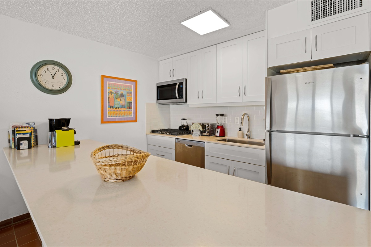 Microwave, cooktop, toaster oven, and fridge, plus fully stocked cabinets!