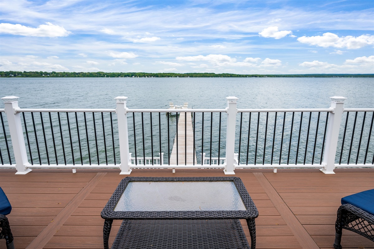Enjoy morning coffee or sunset cocktails from the elevated deck with stunning lakefront views.